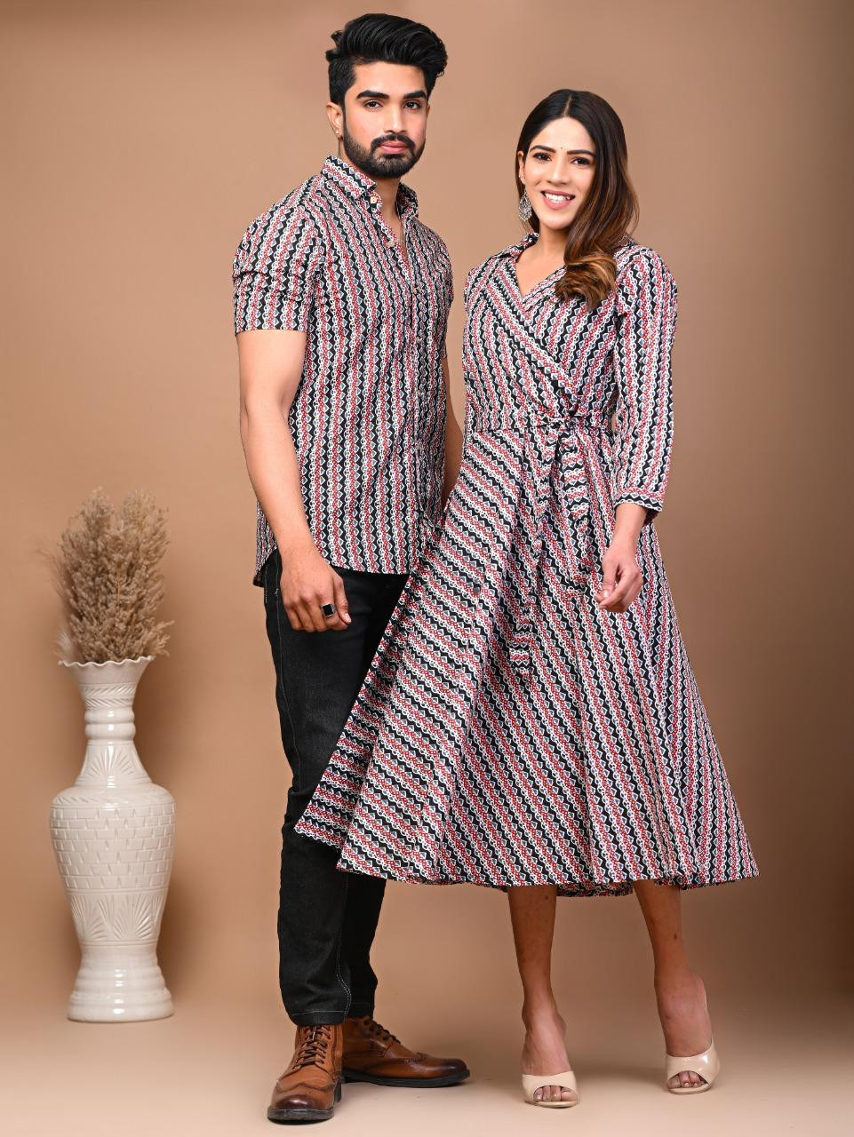 A matching couple's outfit in a black, white, and pink diagonal stripe design, typically made from a cotton material