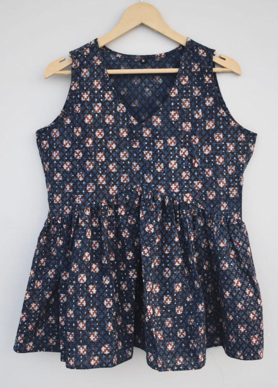Dark blue, hand-block printed, cotton, sleeveless peplum top with a white and reddish-brown geometric pattern