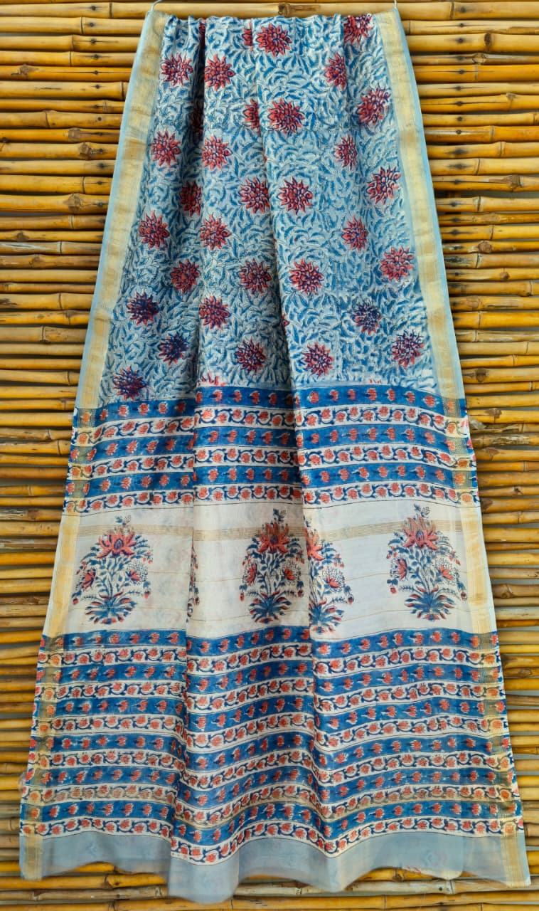 Hand block printed navy blue Maheshwari silk cotton blend saree with zari border.