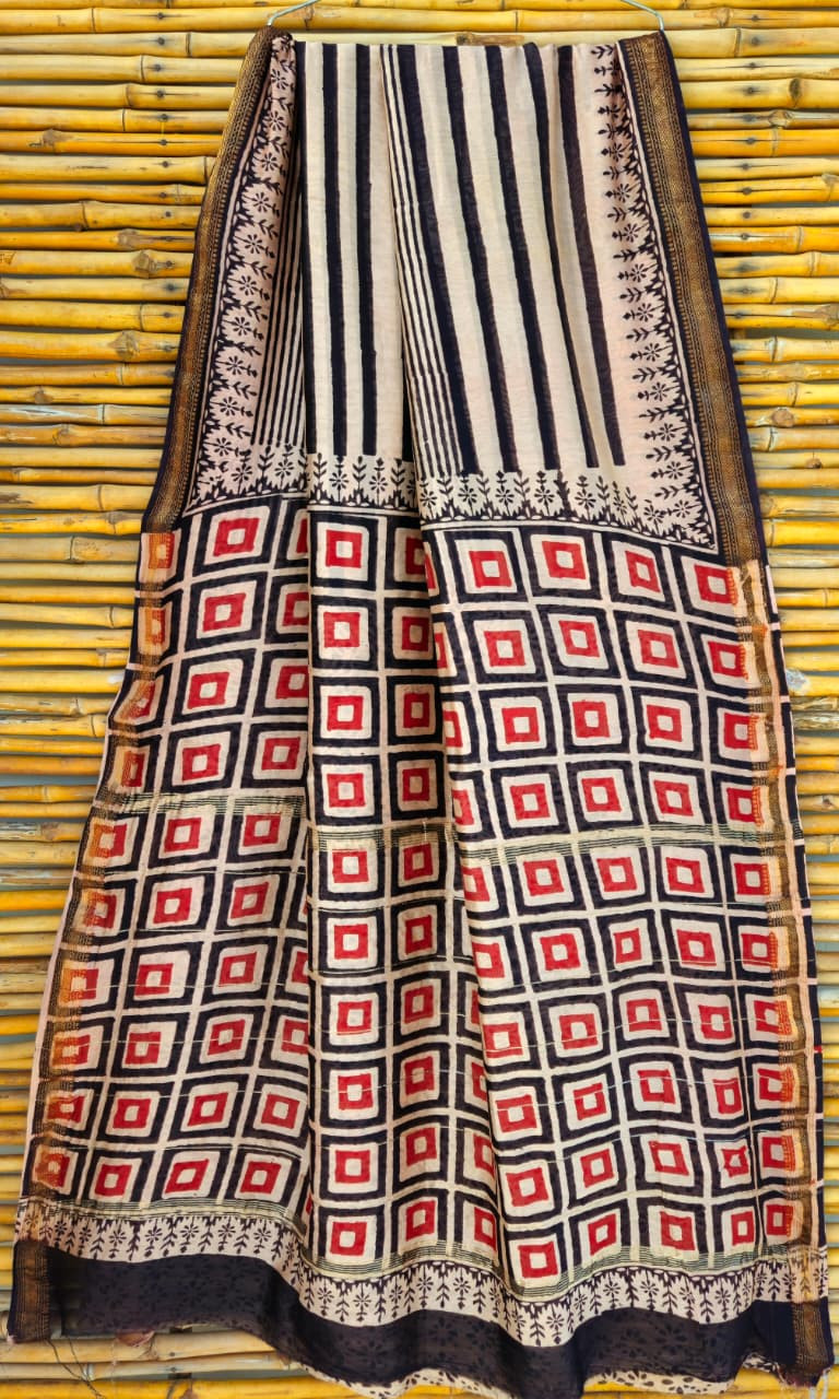 Off-white and black striped Maheshwari silk cotton blend saree with red and black checkered printed pallu