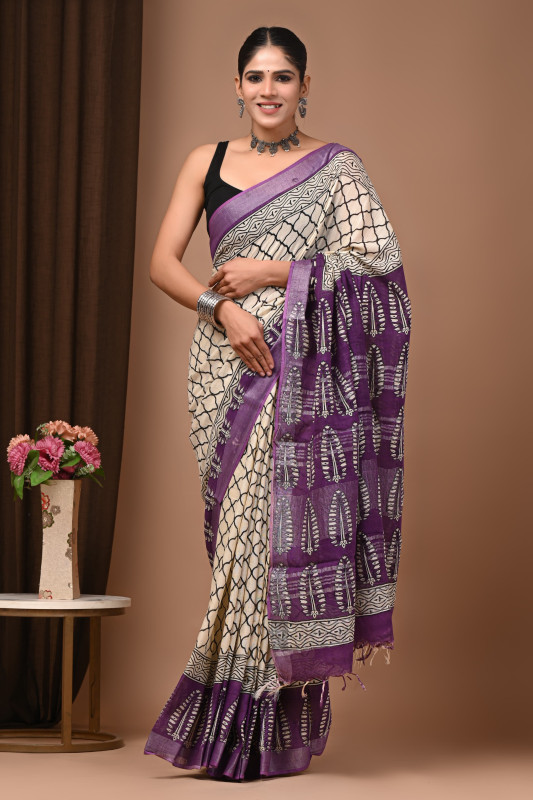 Off‑white and purple handblock printed geometric and floral pattern saree.