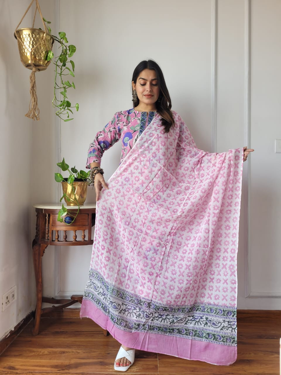 light pink multicolour floral hand block printed cotton kurta, pants, and dupatta suit set.