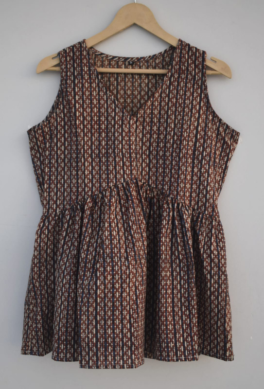 reddish-brown, and off-white vertical striped cotton sleeveless peplum top.