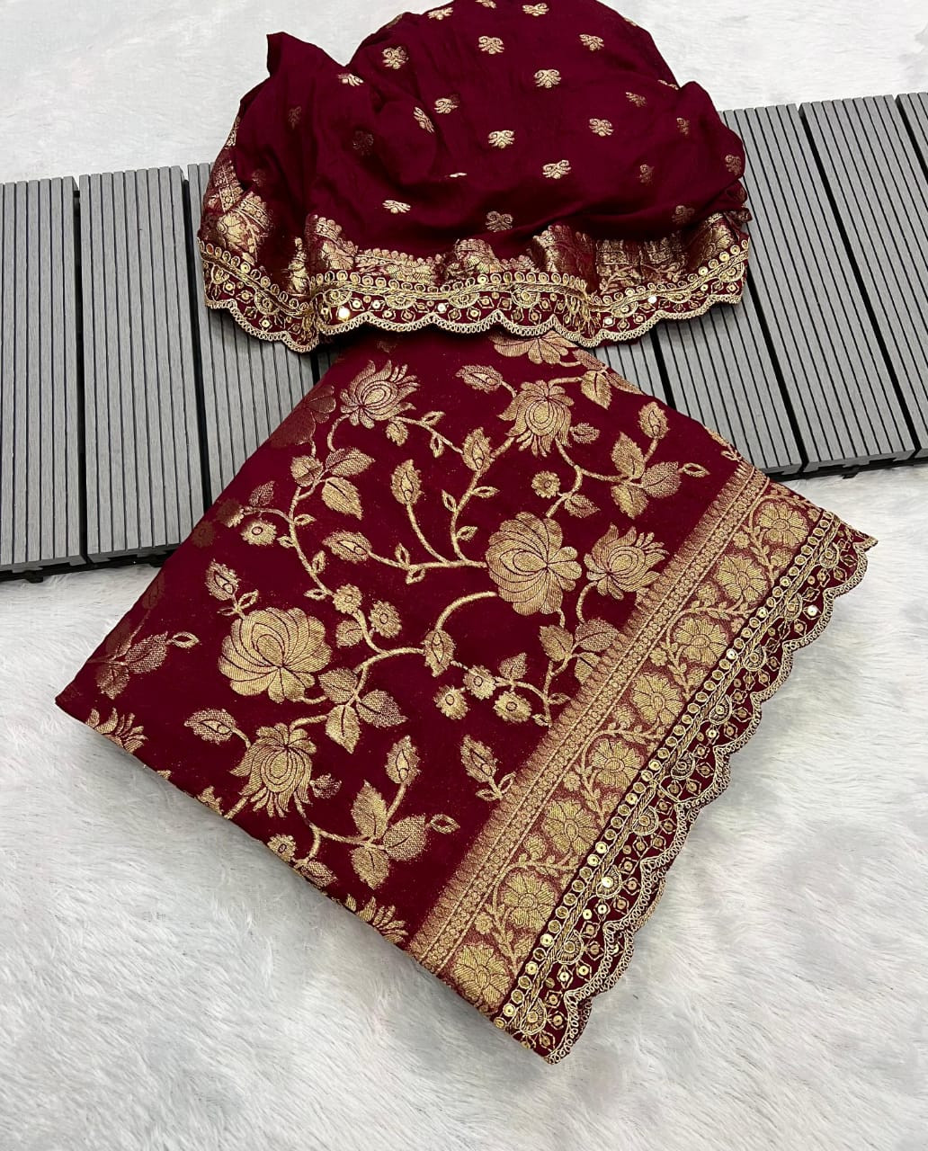 Maroon and Gold Khaddi Georgette ethnic outfit with a floral brocade design.