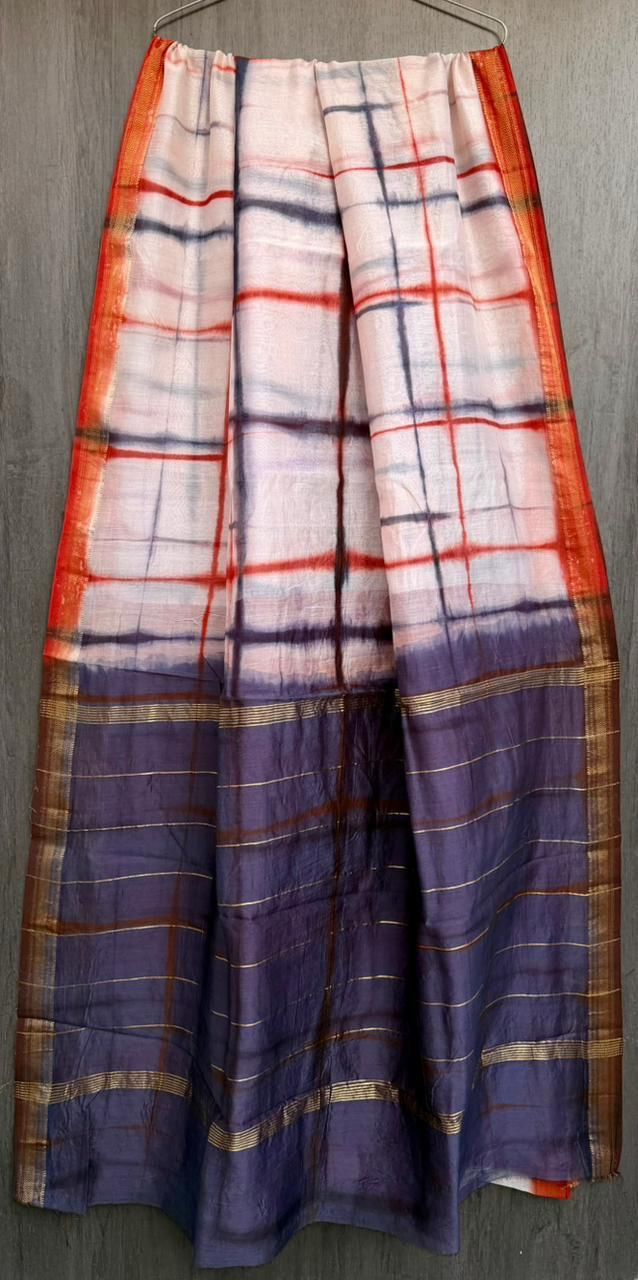 Maheshwari silk saree with a pink, cream, and blue shibori (tie-dye) and check pattern design.
