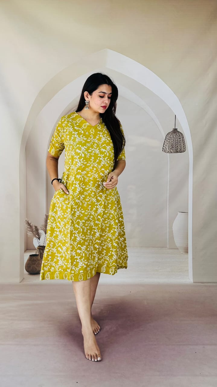 Mustard yellow and white floral printed cotton  kurti.