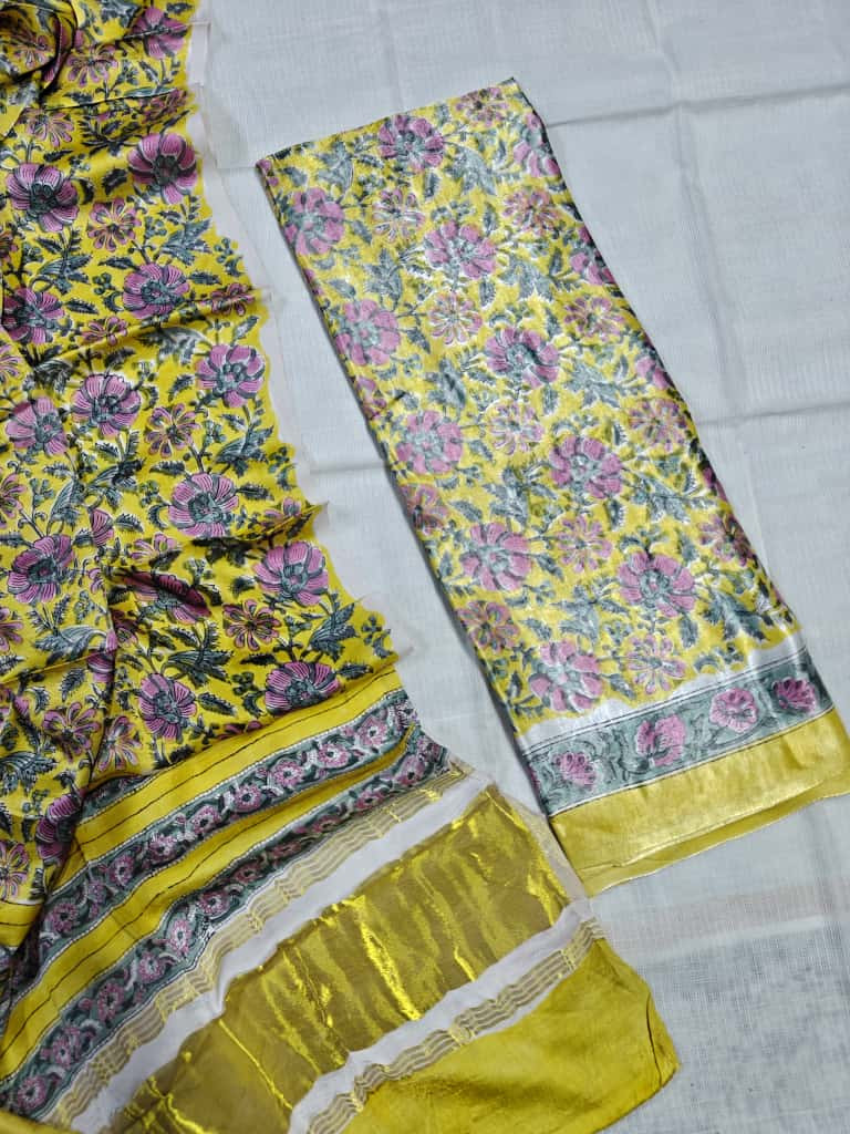 yellow with a pink and green floral design and a shiny border. silk